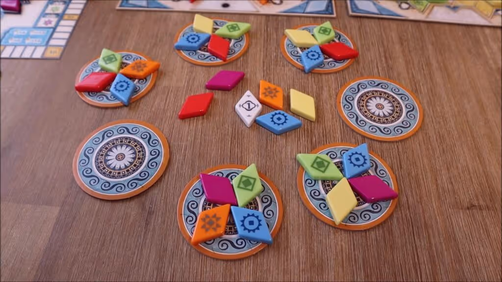 Tiles and game components on a table.