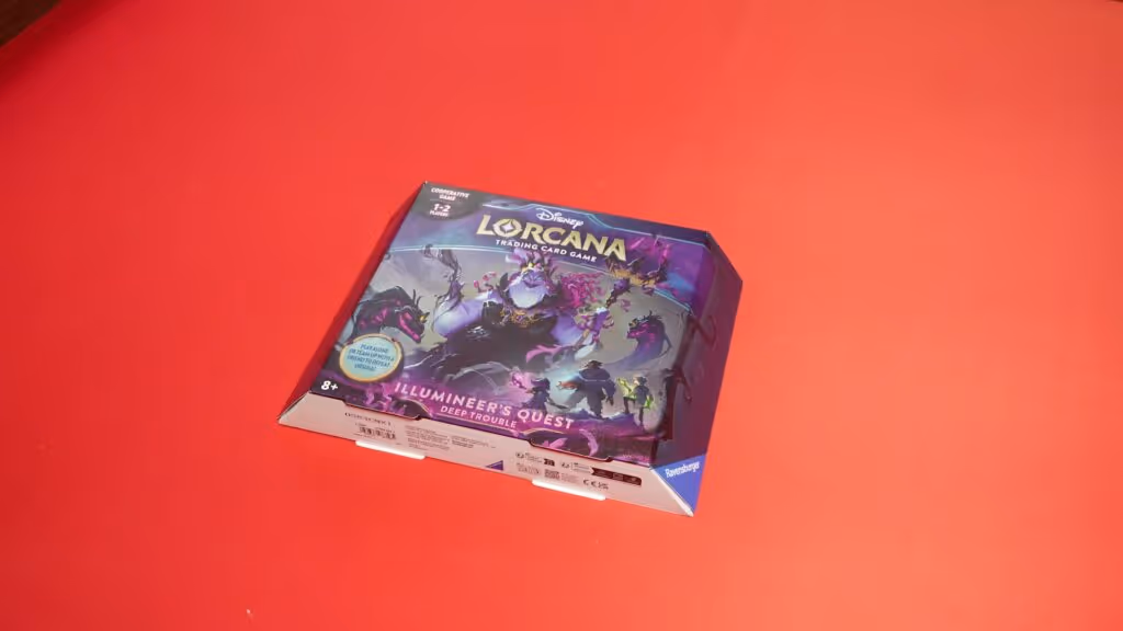 Disney Lorcana Trading Card Game: Illumineer's Odyssey Deep Trouble box on a red background
