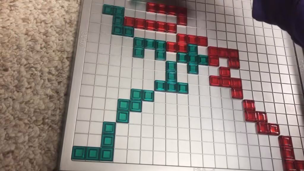 Blokus board game components including colorful pieces and a game board
